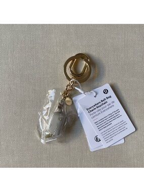 Lululemon Everywhere Belt Bag Charm Keychain - Gray & Gold NWT so cute! 🥰